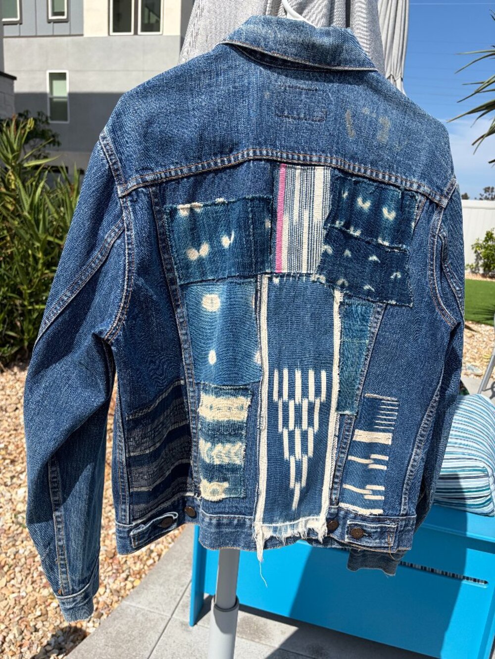 Oversize vintage Levi's jean jacket with vintage African fabric, beading